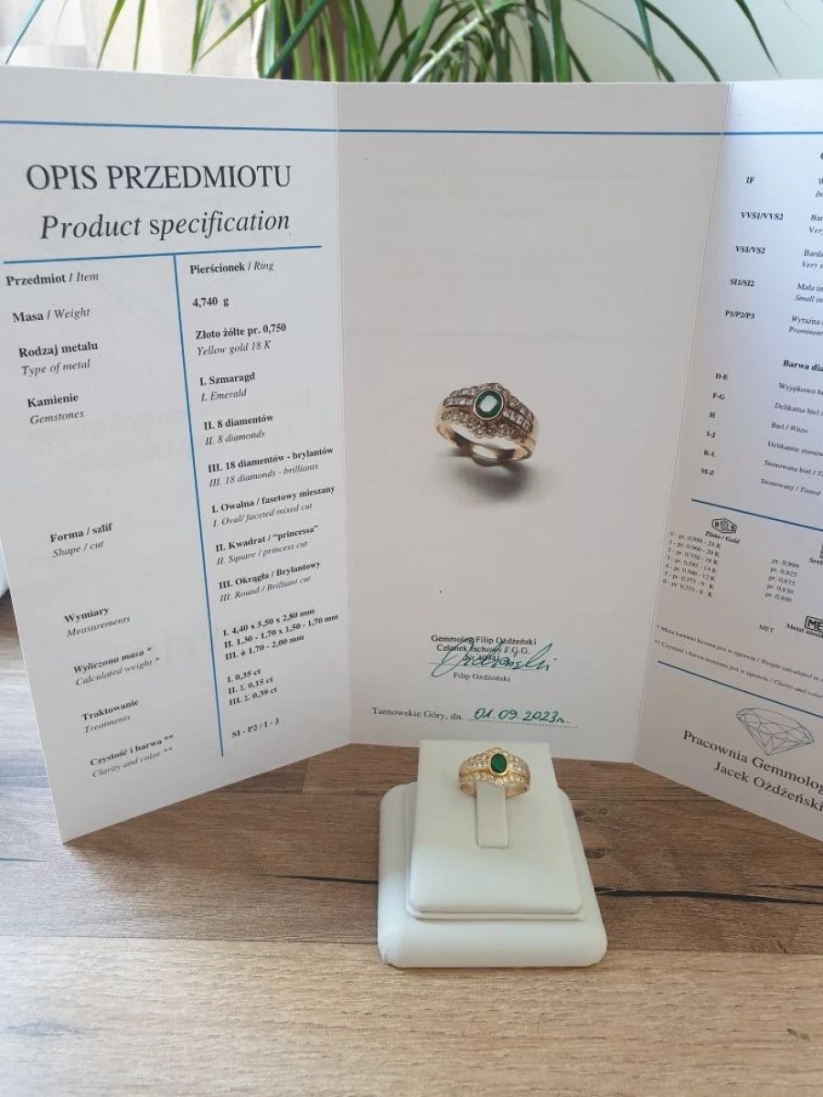 Złoty pierścionek z brylantami 0.54 ct oraz szmaragdem 0.35ct